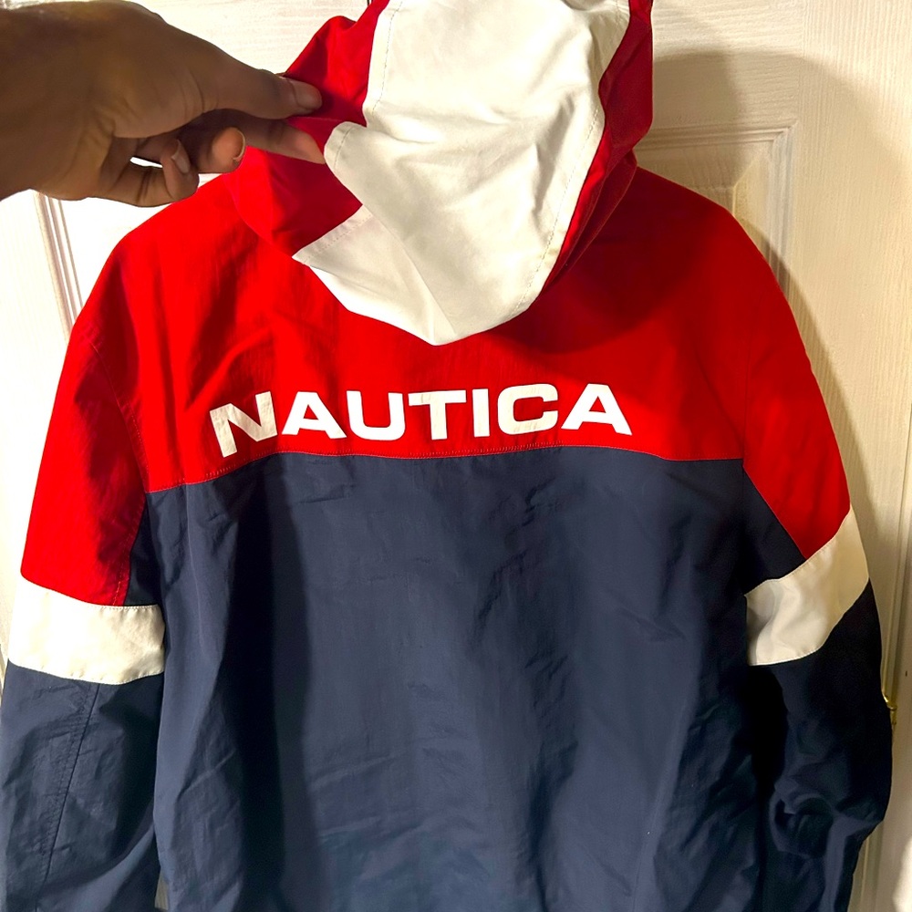 Nautica rain jacket/ wind breaker fits well . Very stylish ! No damage !